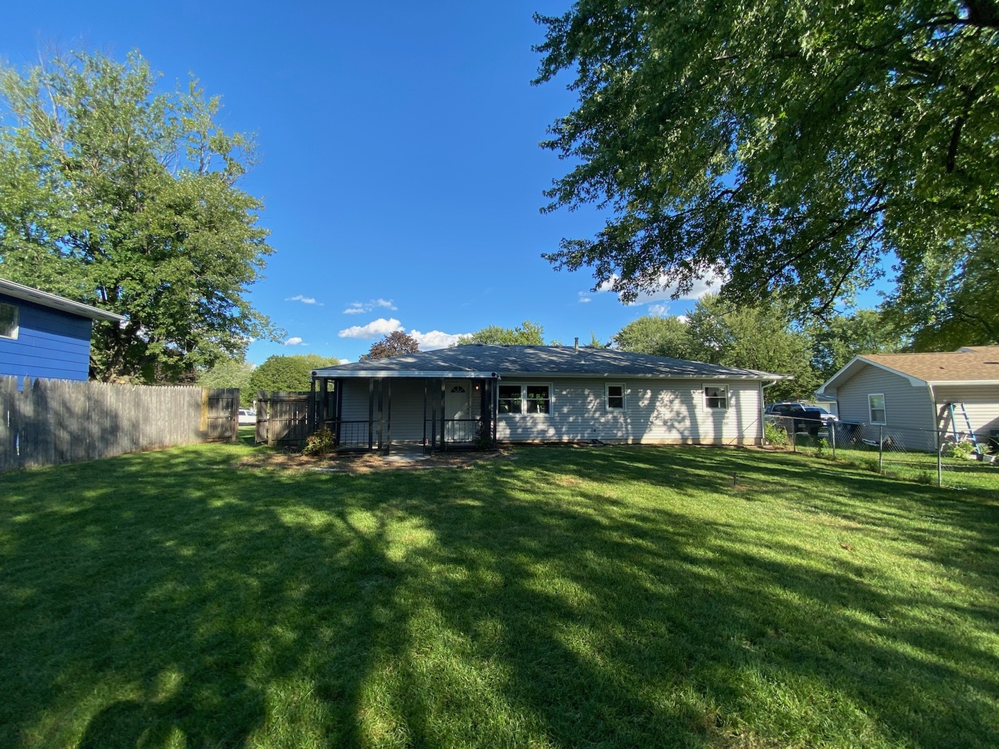 1981 Opal Drive Aurora, IL 60506 - Photo 16 of 18 a view of a house with a big yard and large trees
