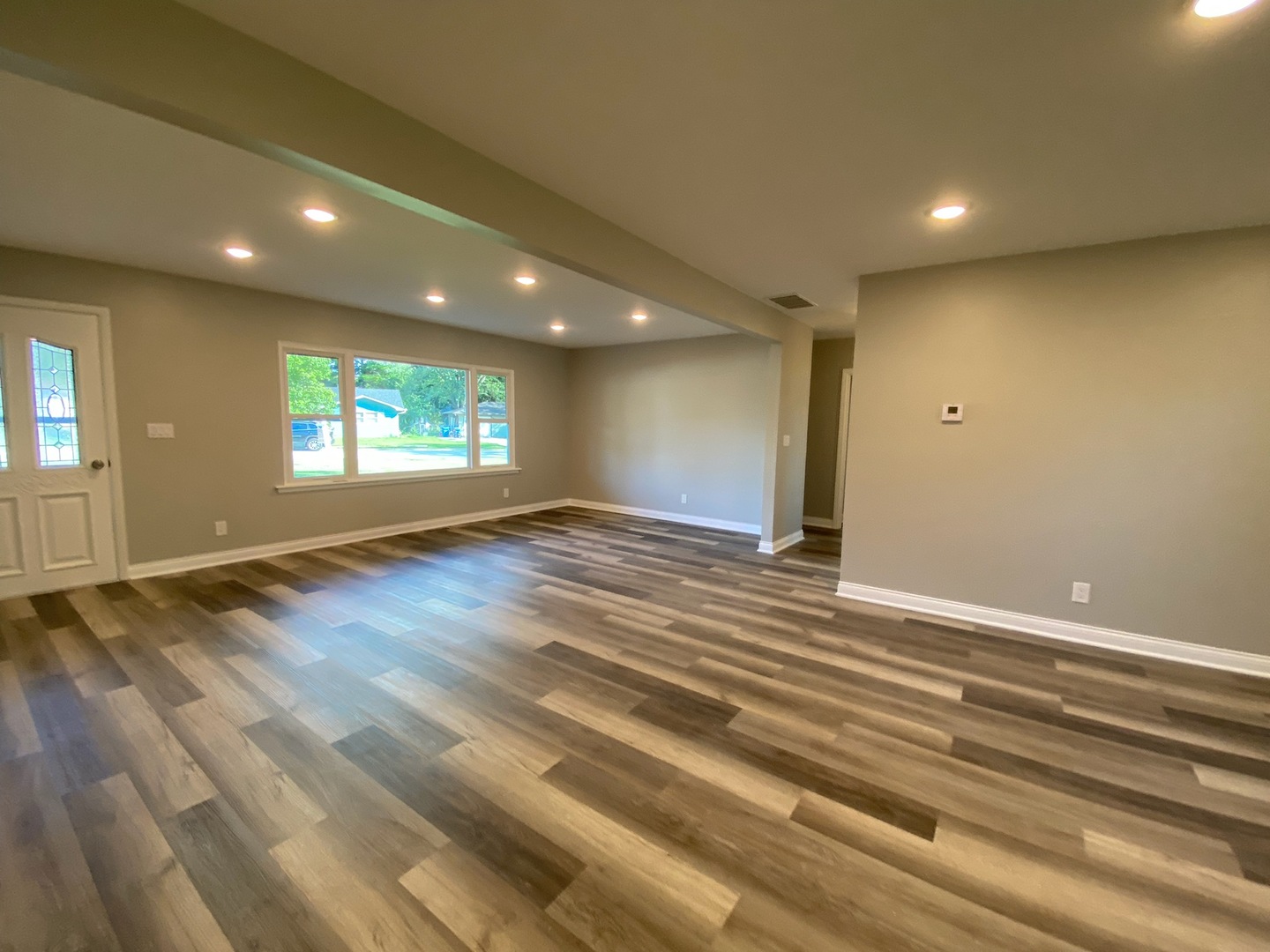 1981 Opal Drive Aurora, IL 60506 - Photo 4 of 18 an empty room with wooden floor and windows