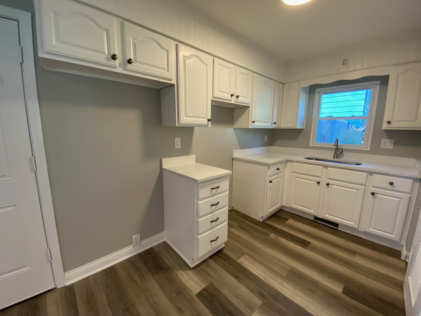 1981 Opal Drive Aurora, IL 60506 - Photo 5 of 18 a kitchen with white cabinets and white appliances