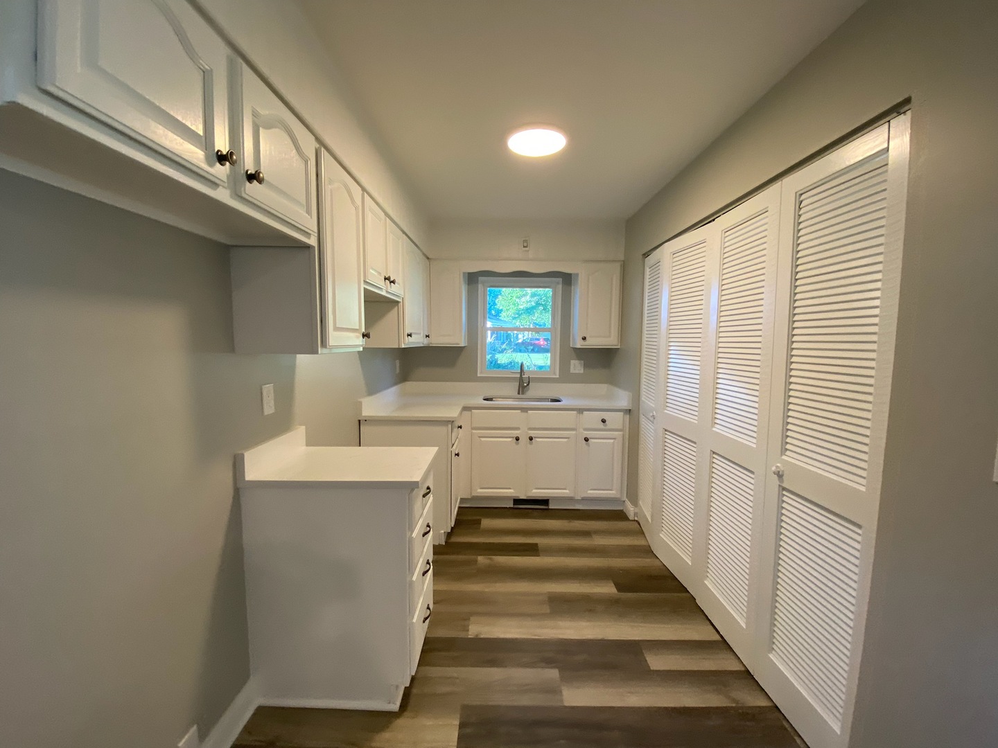 1981 Opal Drive Aurora, IL 60506 - Photo 6 of 18 a kitchen with white cabinets and white appliances