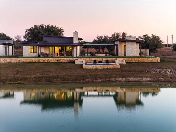 a view of a lake with a house