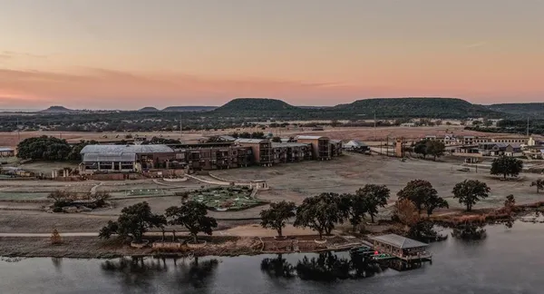 an aerial view of a house with a swimming pool yard and outdoor seating
