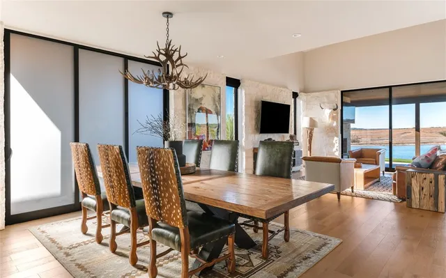 a view of a dining room with furniture window and wooden floor