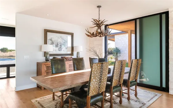 a view of a dining room with furniture window and wooden floor