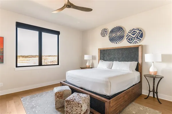 a bedroom with a bed and window