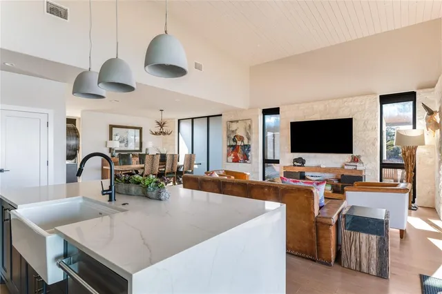 a view of a livingroom with furniture and a flat screen tv
