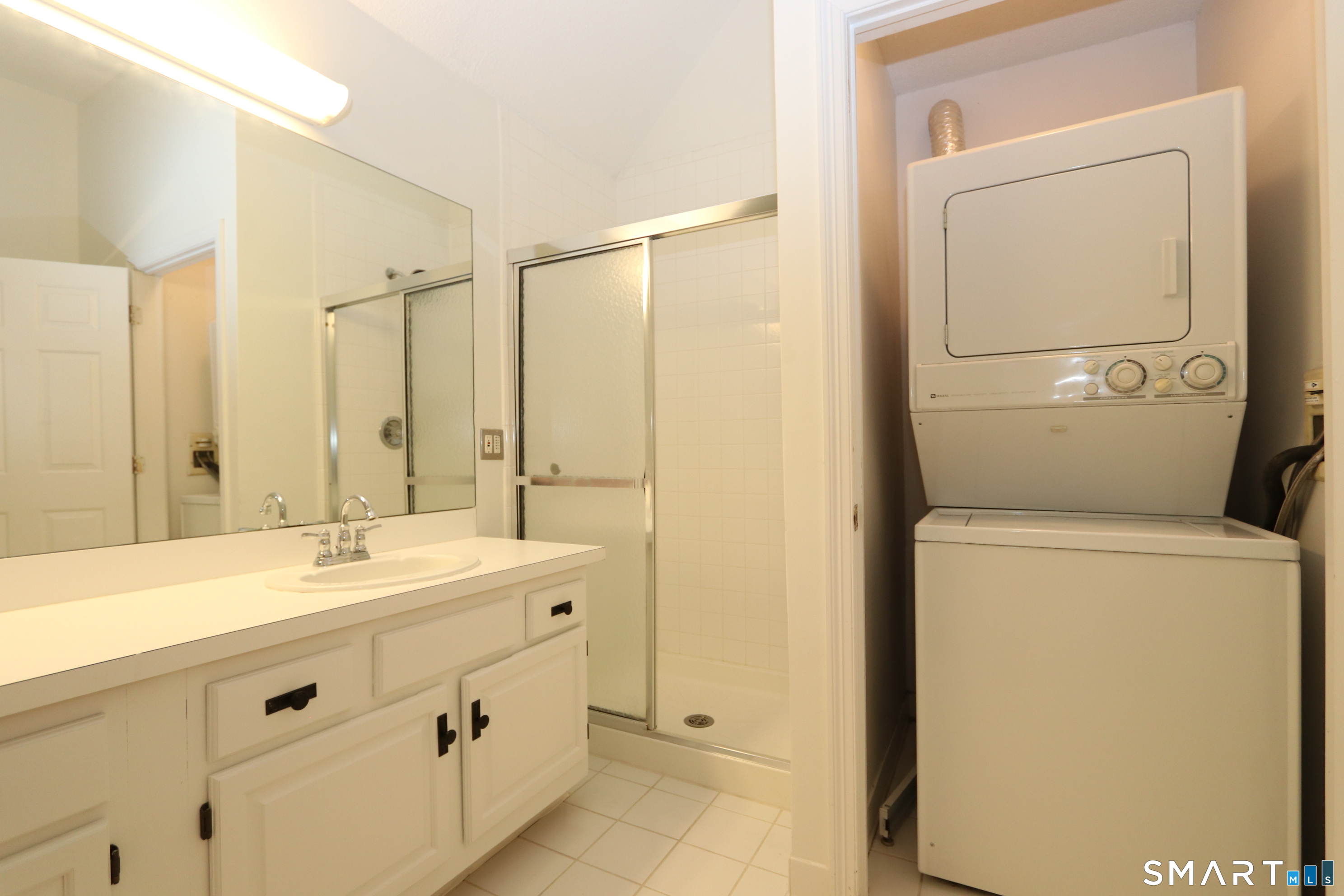 50 Wilton Crest Road, Unit 50 Wilton, CT 06897 - Photo 15 of 31 Washer and dryer conveniently located in the primary bedroom suite