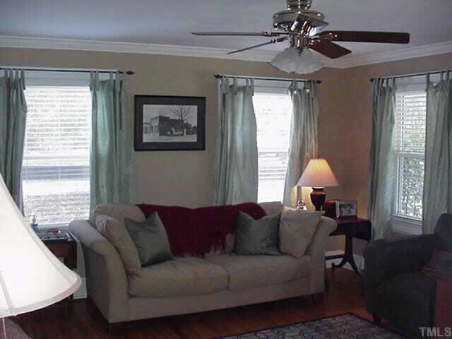 1206 Watauga Street Raleigh, NC 27604 - Photo 2 of 10 Living room has hardwood floors and masonry fireplace. Other