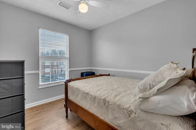 a bedroom with a bed and window