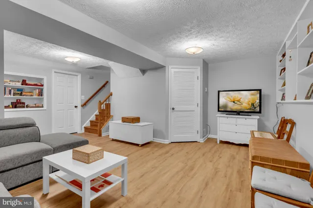 a garden with trees in front of it