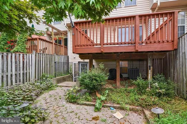 front view of a brick house with a yard