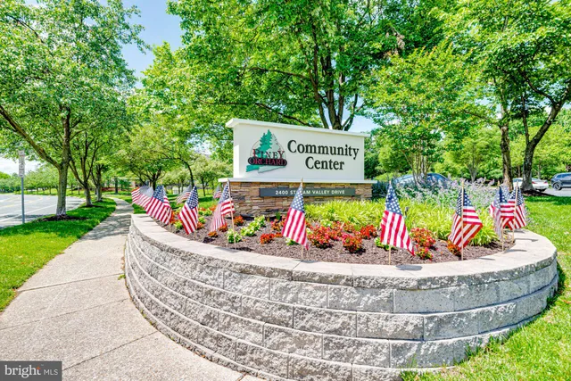 a view of a lake with sitting area and swimming pool