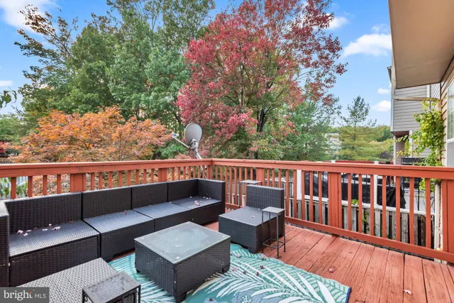 a view of a chairs and table in the balcony