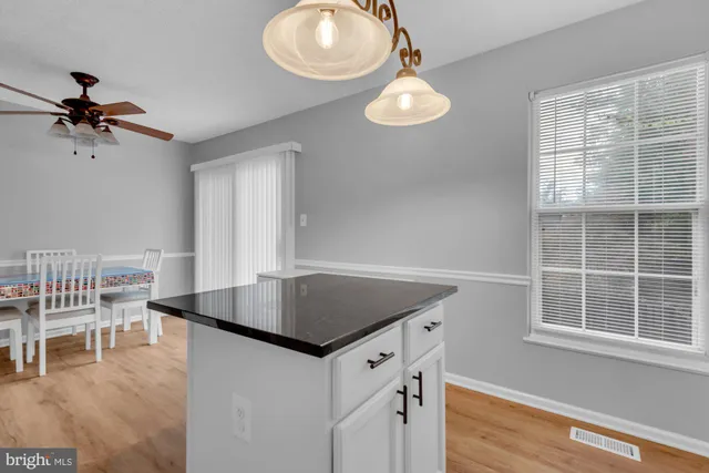 a bathroom with a toilet sink and a mirror