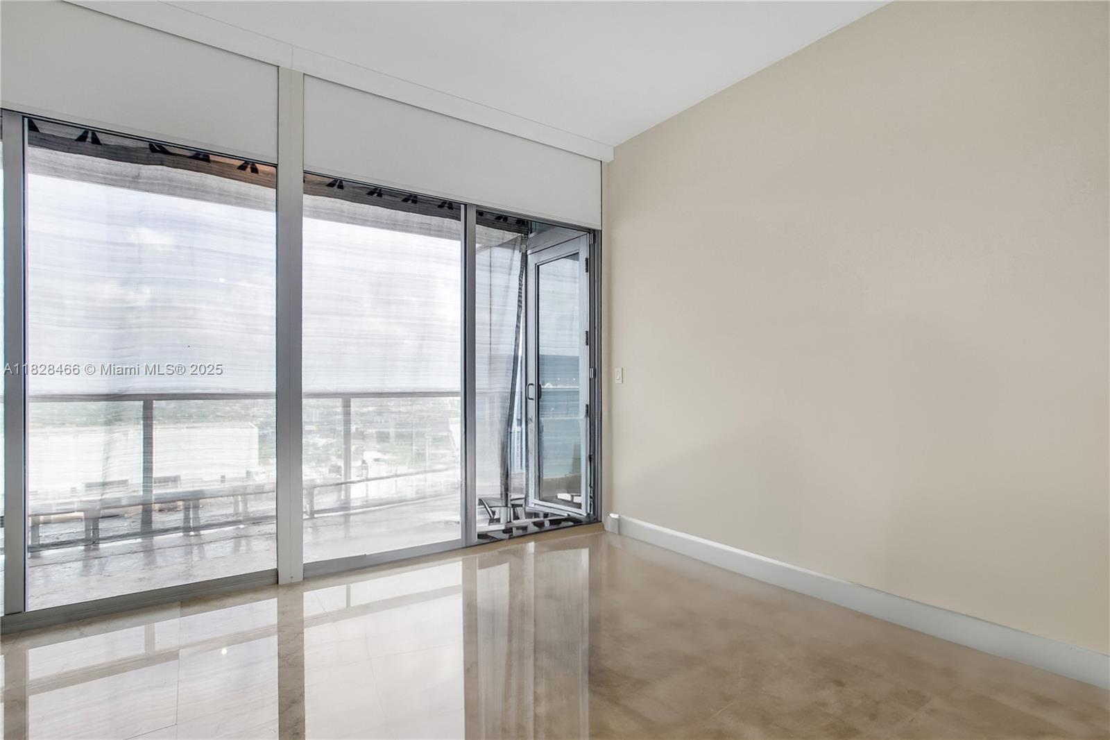 1425 Brickell Avenue, Unit 44AB Miami, FL 33131 - Photo 13 of 19 a view of an empty room and window