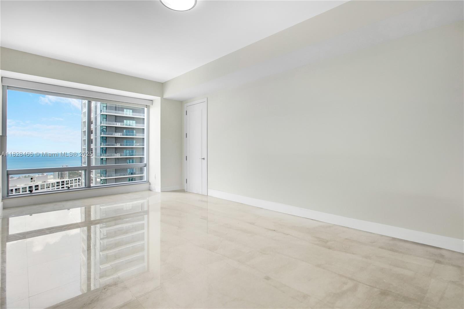 1425 Brickell Avenue, Unit 44AB Miami, FL 33131 - Photo 16 of 19 wooden floor in a empty room
