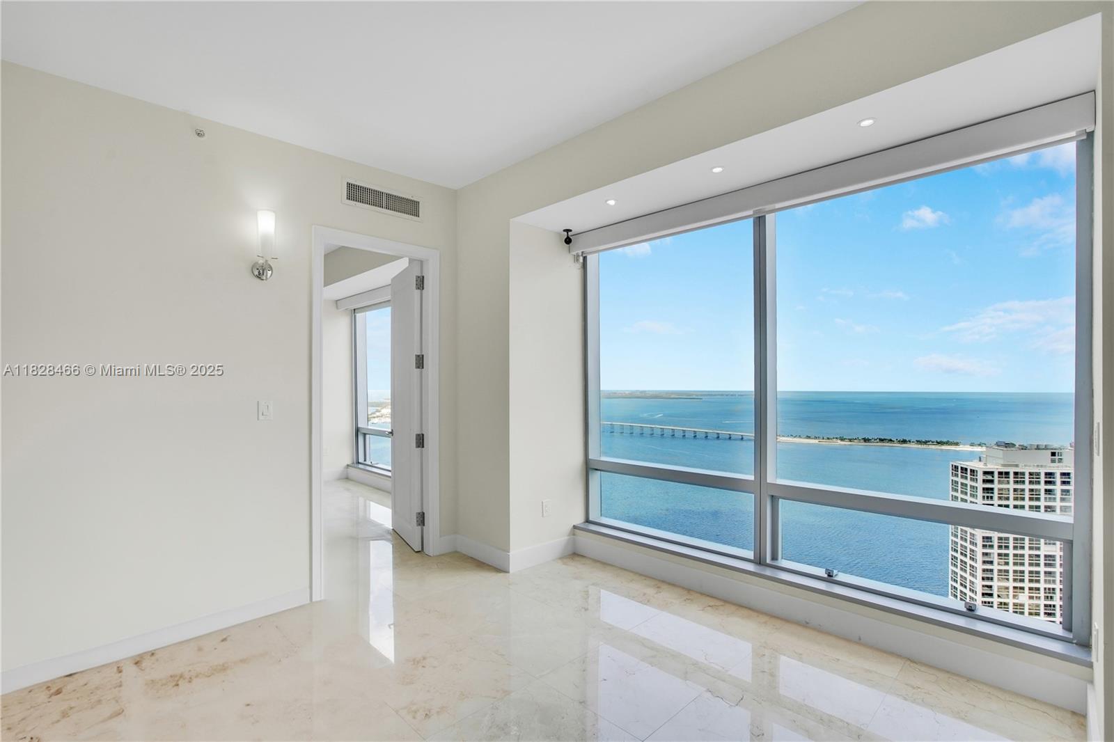 1425 Brickell Avenue, Unit 44AB Miami, FL 33131 - Photo 19 of 19 a view of an empty room and a window