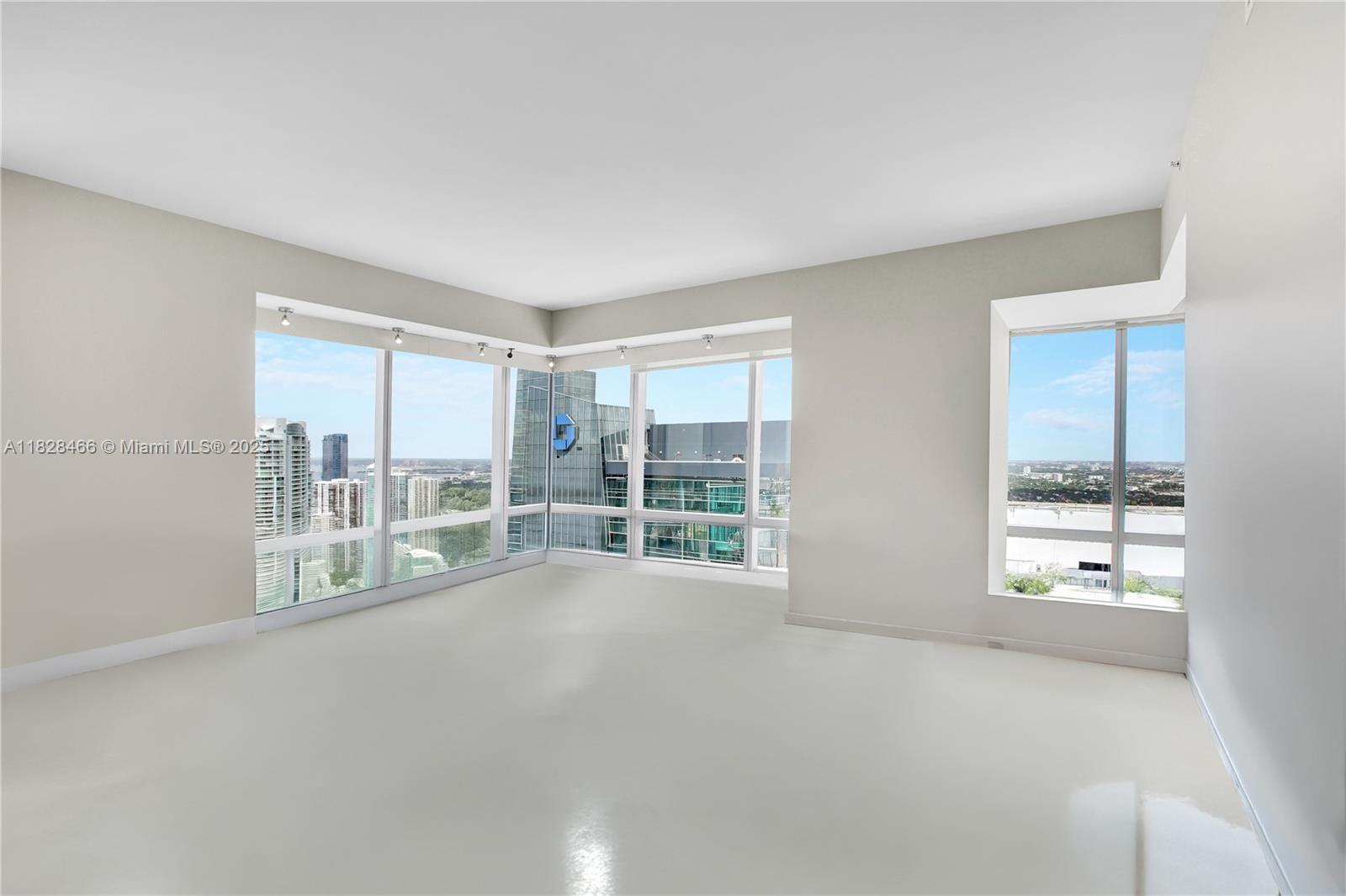 1425 Brickell Avenue, Unit 44AB Miami, FL 33131 - Photo 3 of 19 a view of an empty room with a window