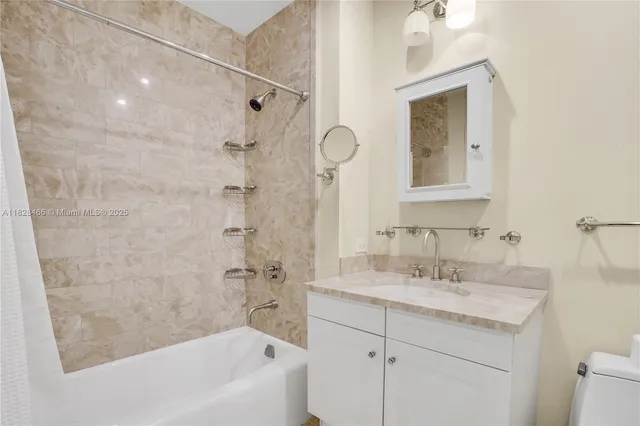 a bathroom with a sink a mirror and a bathtub