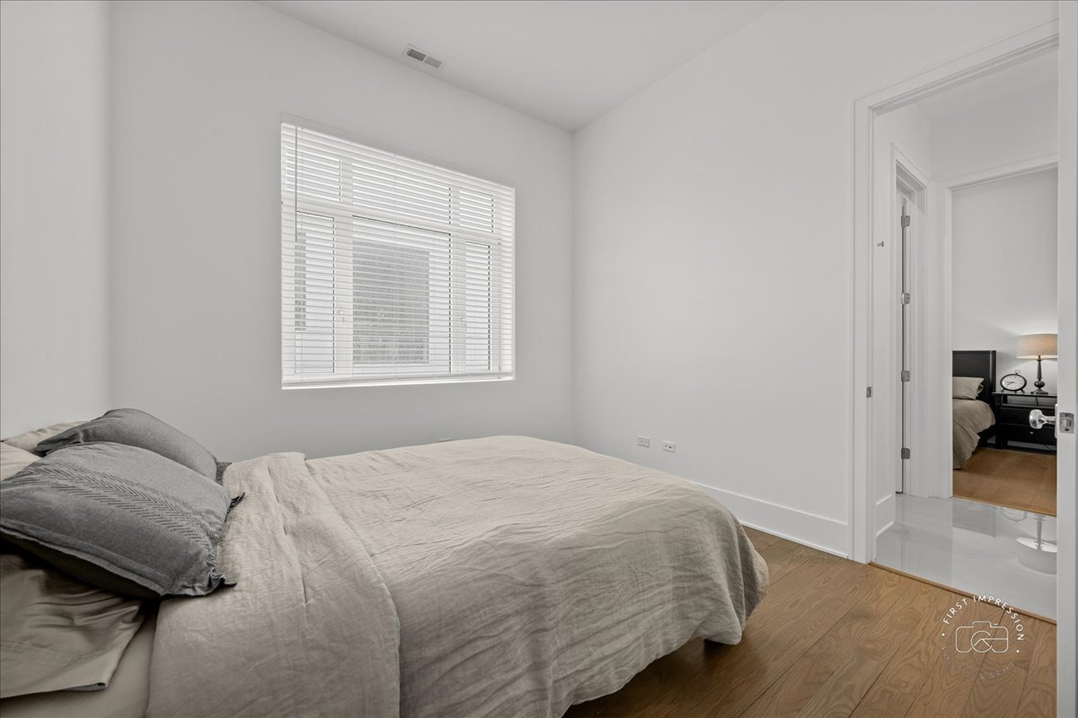 195 North Addison Avenue, Unit PH03 Elmhurst, IL 60126 - Photo 13 of 36 a bedroom with a bed and a window