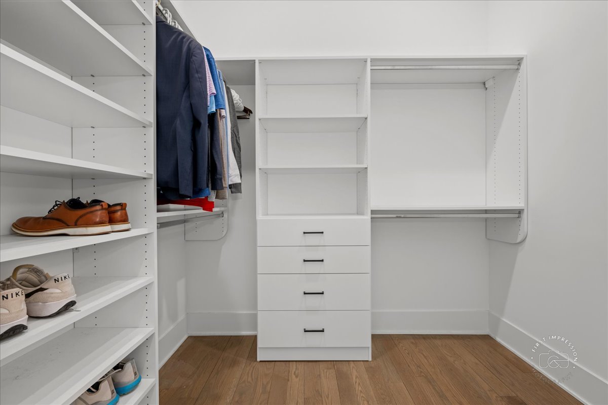 195 North Addison Avenue, Unit PH03 Elmhurst, IL 60126 - Photo 21 of 36 a view of walk in closet with clothes and shoes