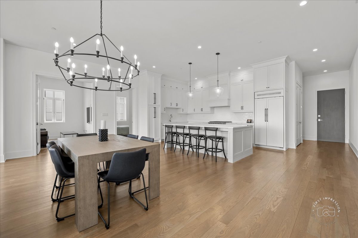 195 North Addison Avenue, Unit PH03 Elmhurst, IL 60126 - Photo 5 of 36 a view of a dining room with furniture and wooden floor
