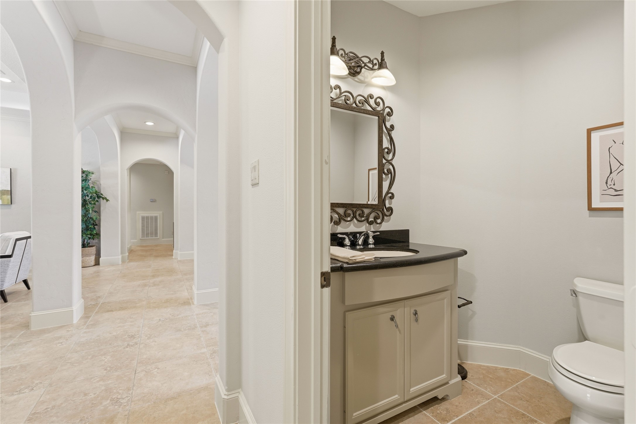 8111 Hideaway Lake Circle Spring, TX 77389 - Photo 38 of 48 a bathroom with a granite countertop toilet sink and mirror