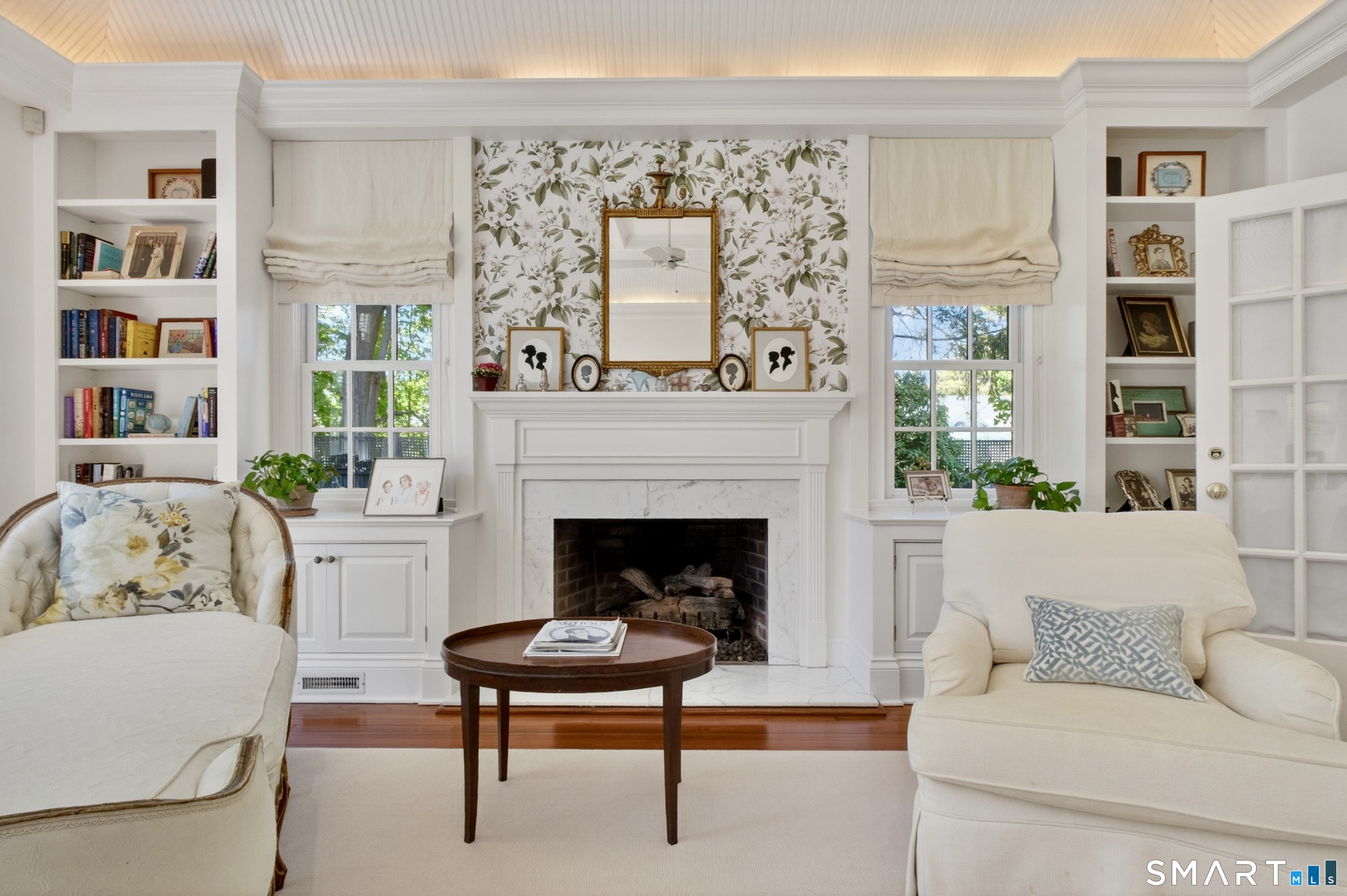 41 Peaceable Street Ridgefield, CT 06877 - Photo 27 of 40 a living room with furniture and a fireplace