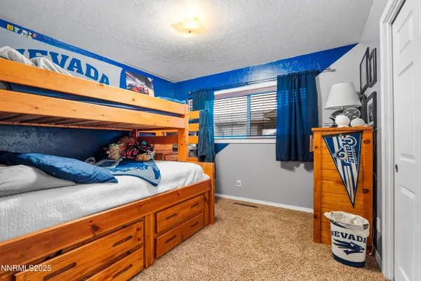 a bed room with furniture and a potted plant