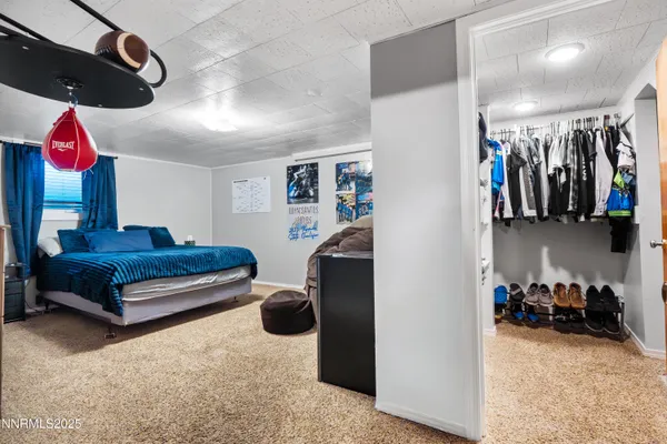 a bedroom with furniture and a bed