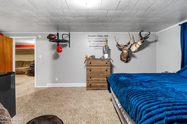 a spacious bedroom with a bed and a couch