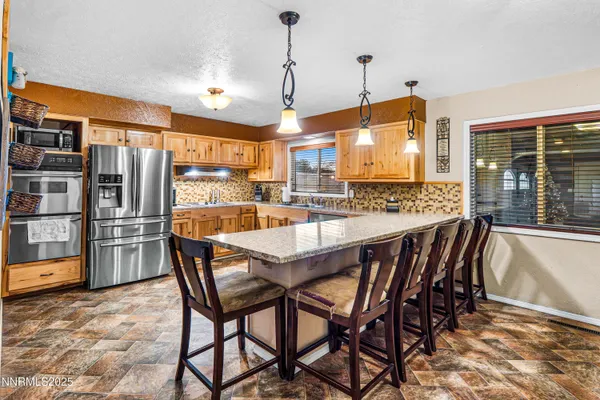 a dining area with furniture and window
