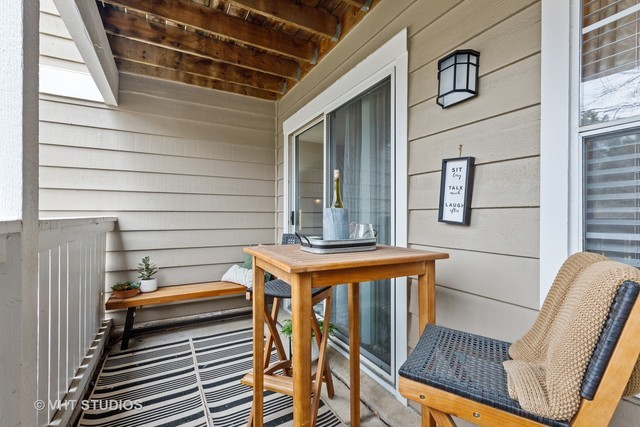 72 Aster Drive, Unit 2024 Schaumburg, IL 60173 - Photo 18 of 31 a view of a balcony with chairs