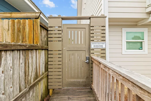 a view of a balcony with wooden walls and stairs