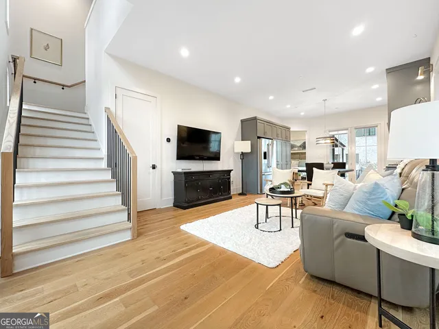 a living room with fireplace furniture and a flat screen tv