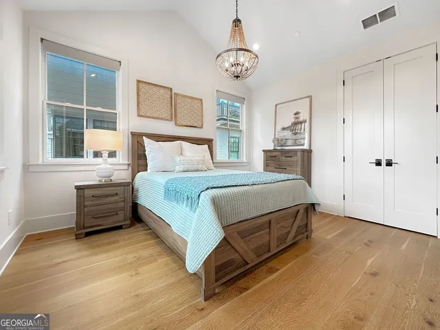 a bed room with a bed and a window