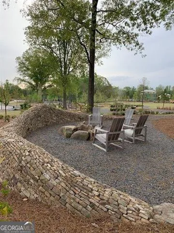 a view of a lake with outdoor seating