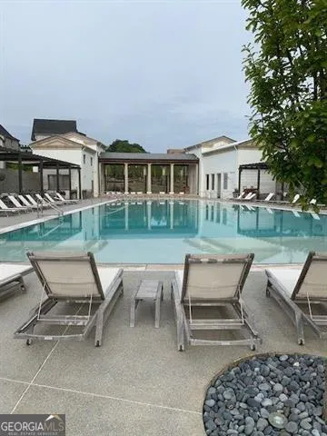 a view of a house with backyard sitting area