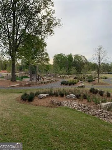 a view of a street with lots of car parked