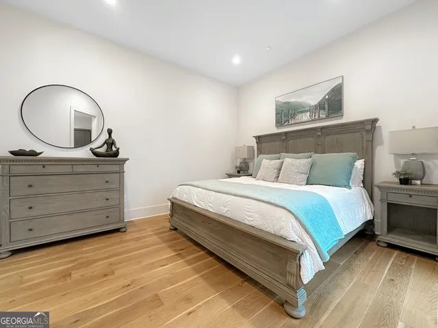 a bedroom with a bed and a dresser