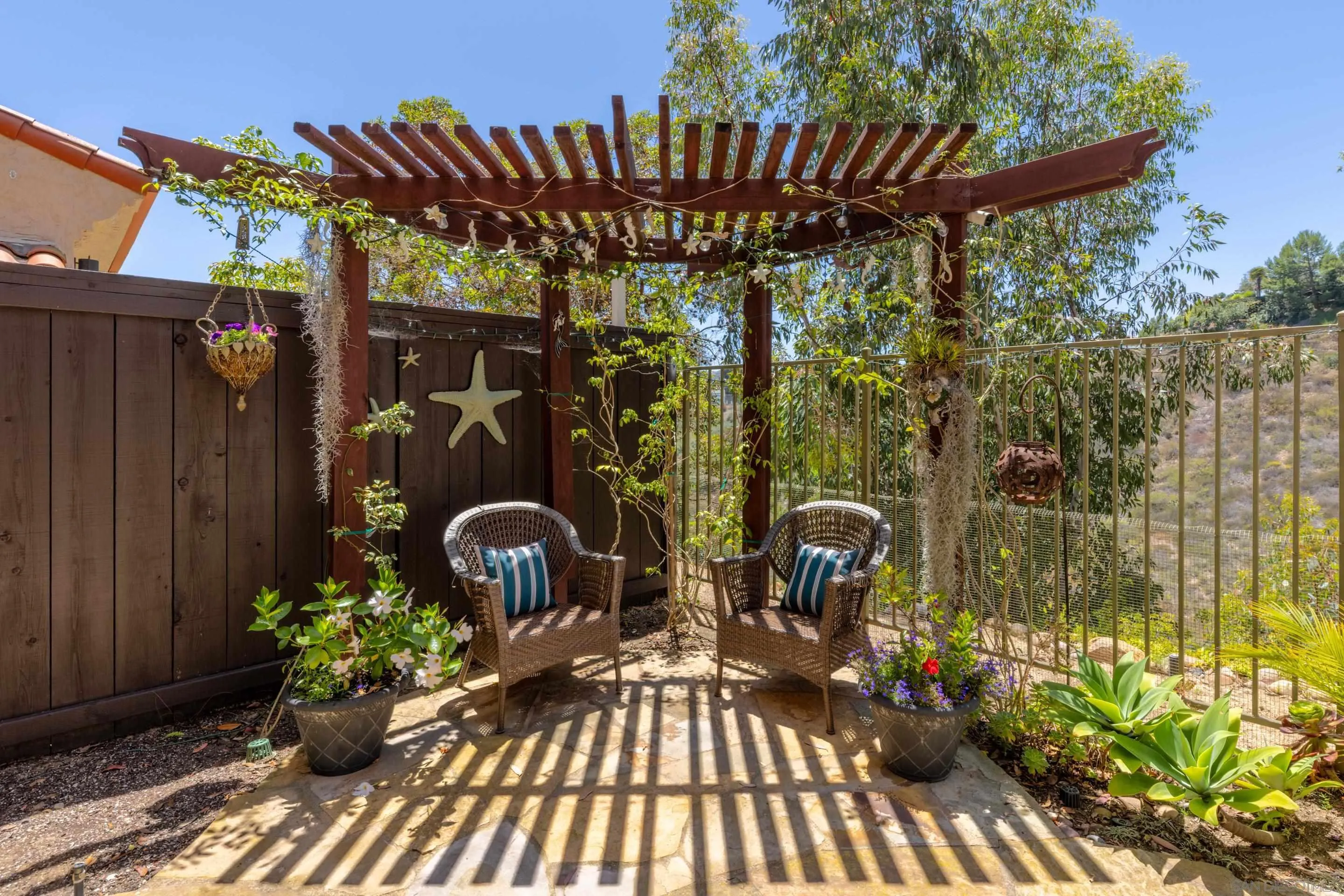 1466 Caminito Solidago La Jolla, CA 92037 - Photo 15 of 62 a view of a chairs and table in the patio