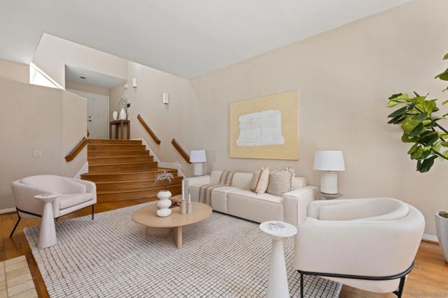 a bathroom with a granite countertop sink mirror and a bathtub