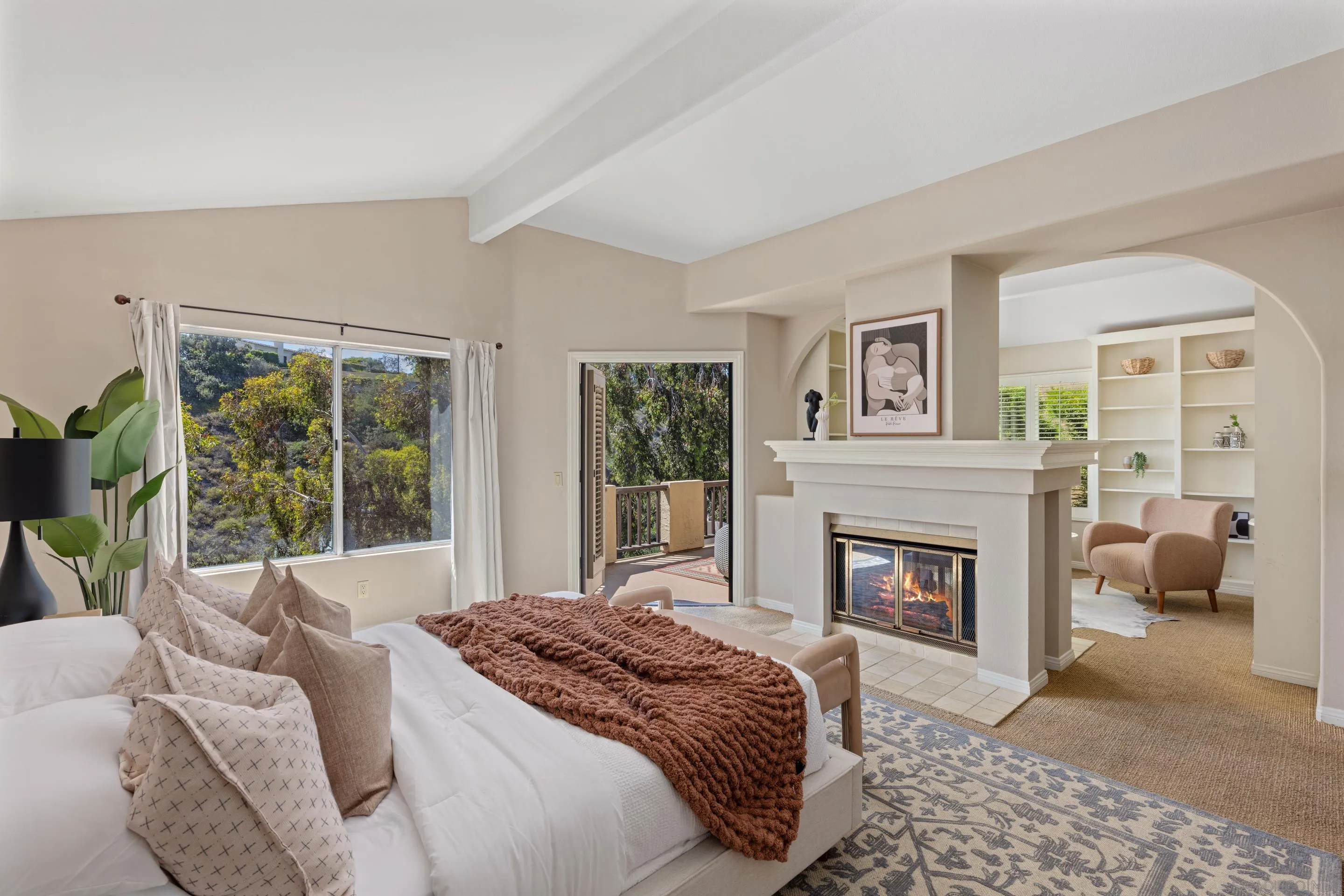 1466 Caminito Solidago La Jolla, CA 92037 - Photo 20 of 62 a bedroom with a bed and a fireplace