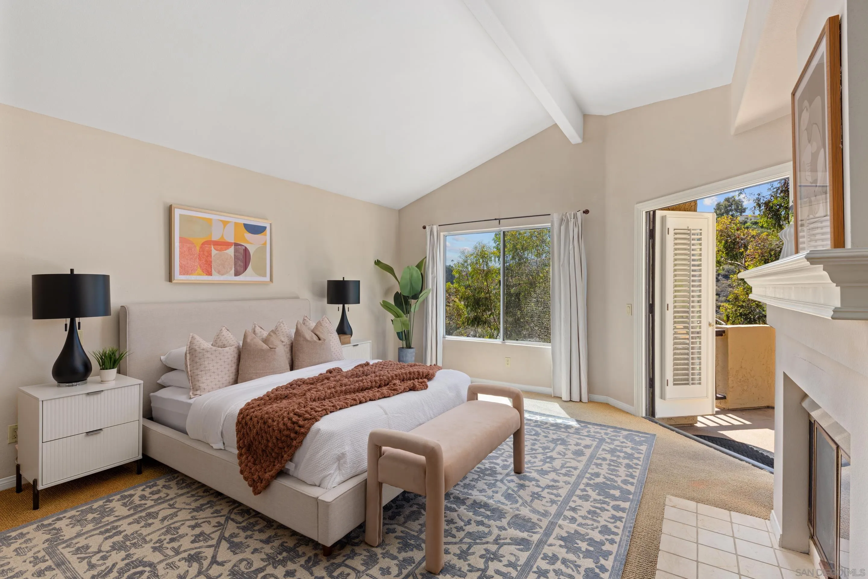 1466 Caminito Solidago La Jolla, CA 92037 - Photo 21 of 62 a bedroom with a bed and a couch