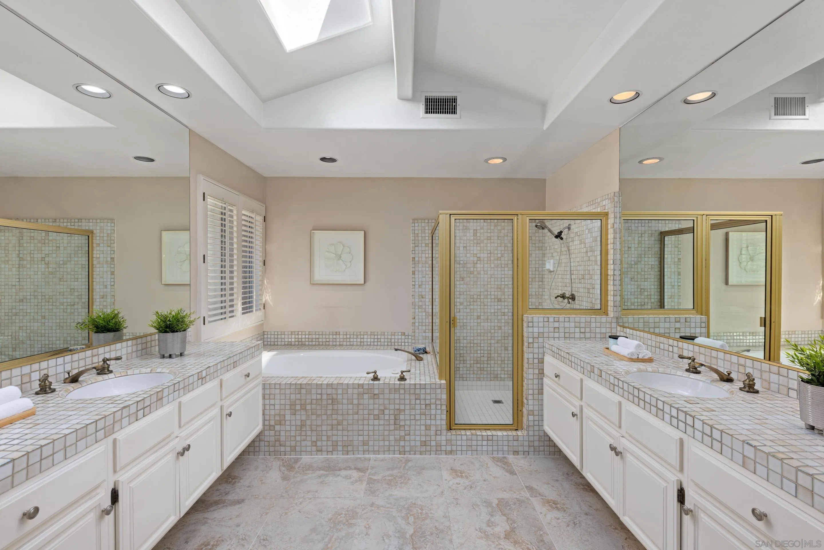 1466 Caminito Solidago La Jolla, CA 92037 - Photo 23 of 62 a spacious bathroom with a double vanity sink mirror double and shower