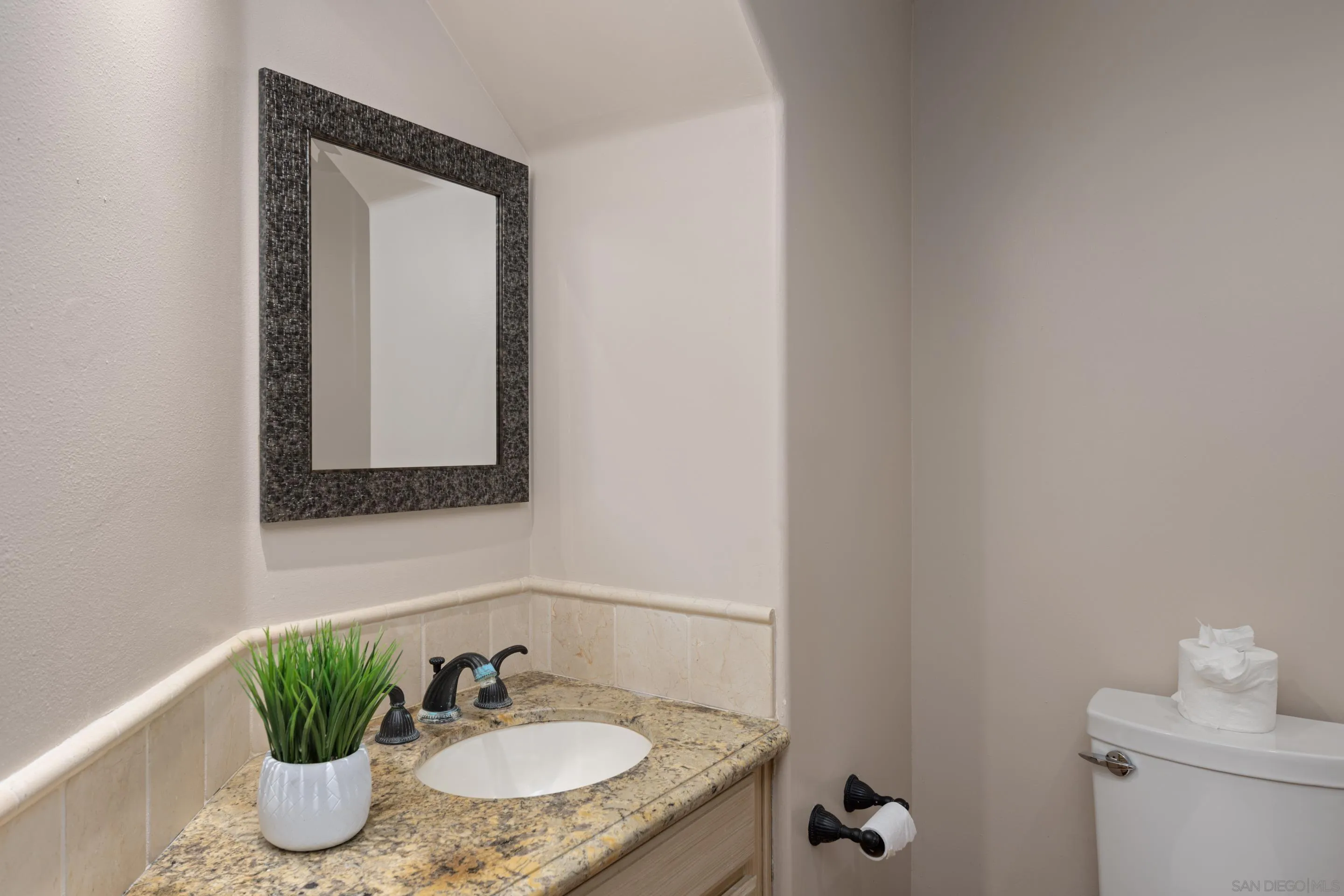 1466 Caminito Solidago La Jolla, CA 92037 - Photo 26 of 62 a bathroom with a granite countertop sink and a mirror