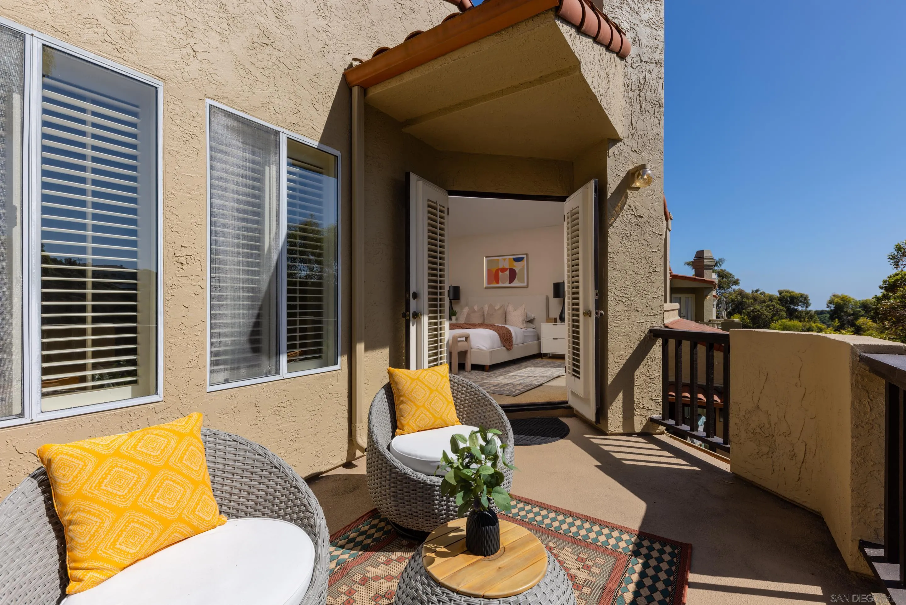 1466 Caminito Solidago La Jolla, CA 92037 - Photo 27 of 62 a view of a living room and a couches in a patio