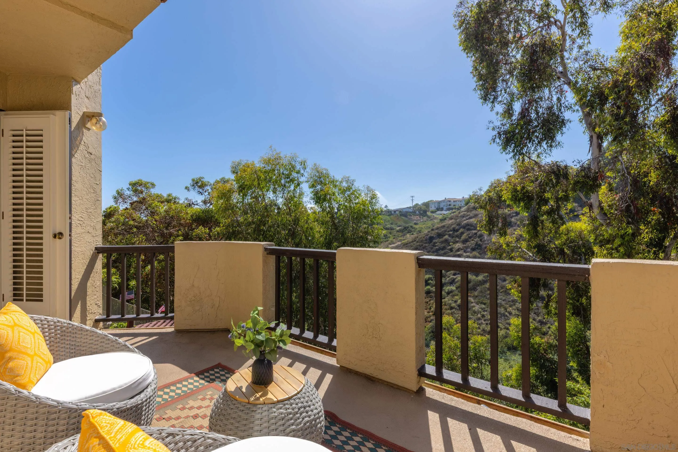 1466 Caminito Solidago La Jolla, CA 92037 - Photo 28 of 62 a view of a balcony with chairs and a potted plant