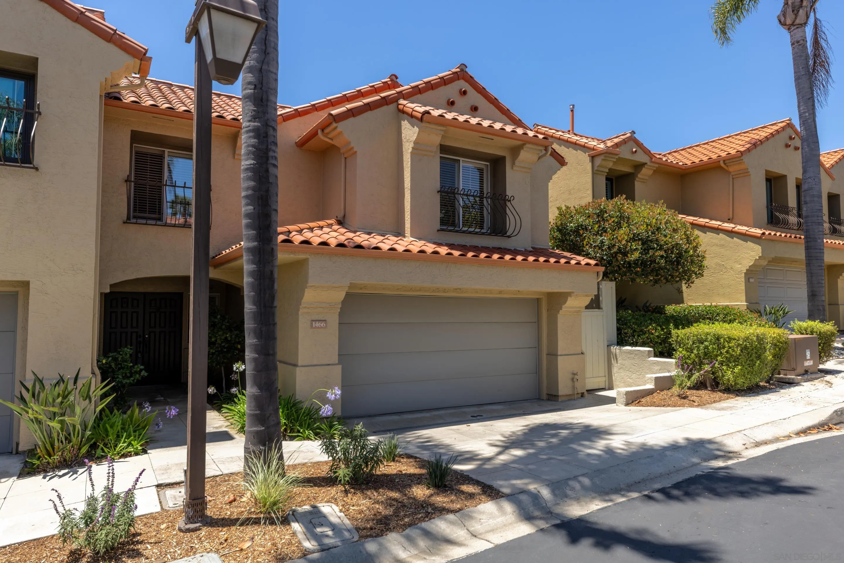 1466 Caminito Solidago La Jolla, CA 92037 - Photo 30 of 62 a front view of a house with a yard