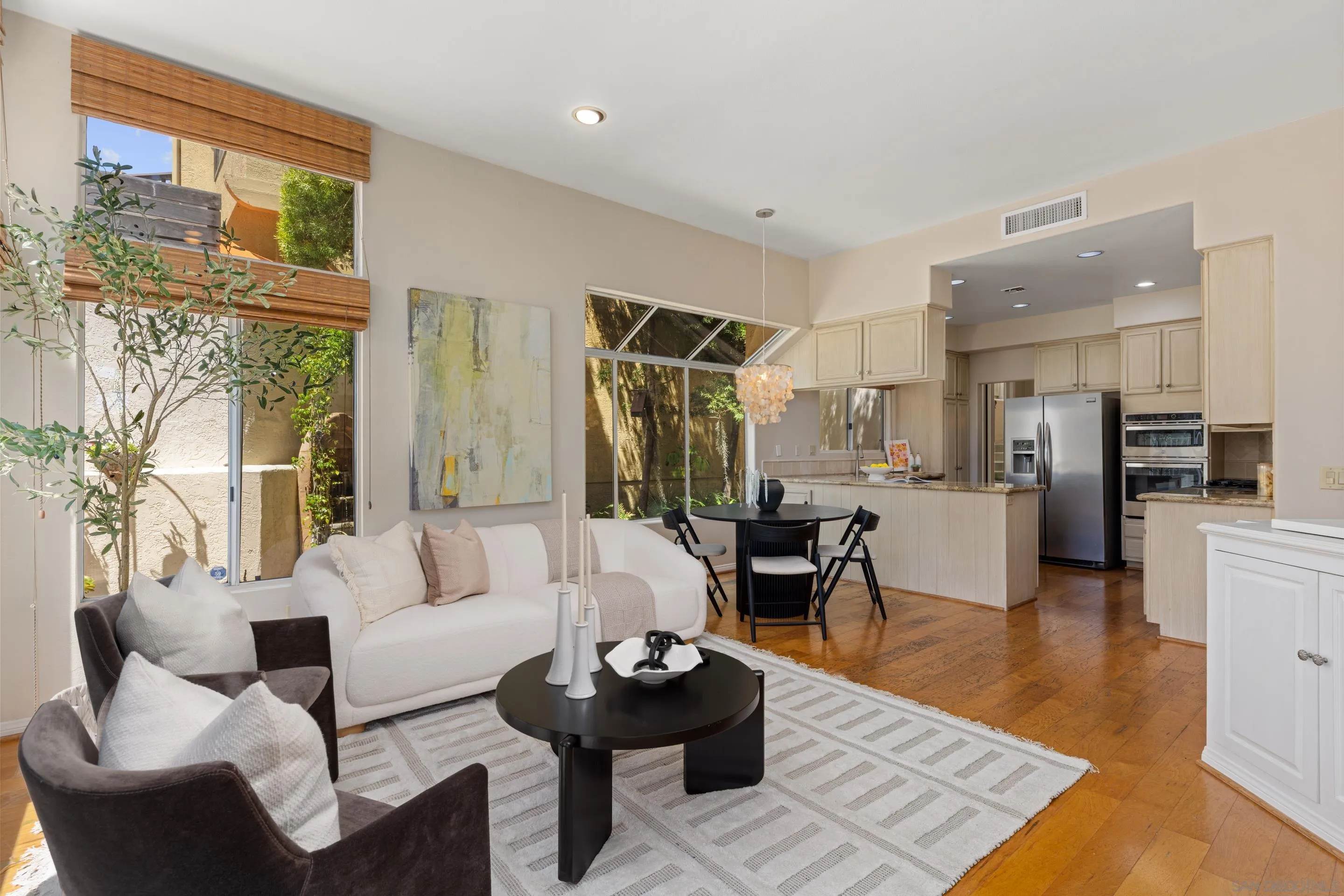 1466 Caminito Solidago La Jolla, CA 92037 - Photo 7 of 62 a living room with furniture and kitchen view
